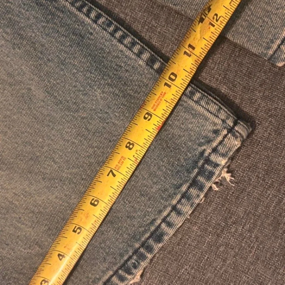 Baggy blue Sean John jeans with a distressed look Size 38x32